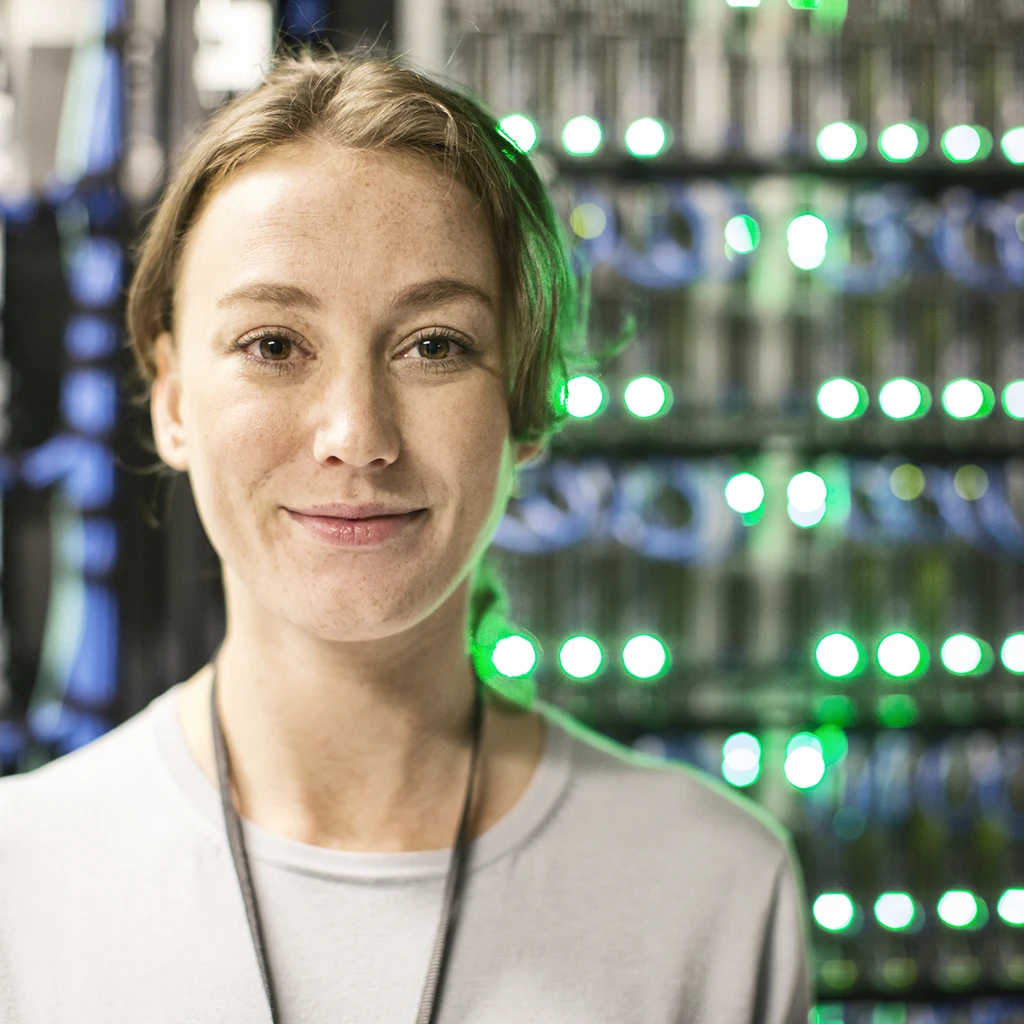 caucasian-woman-technician-in-a-large-computer-server